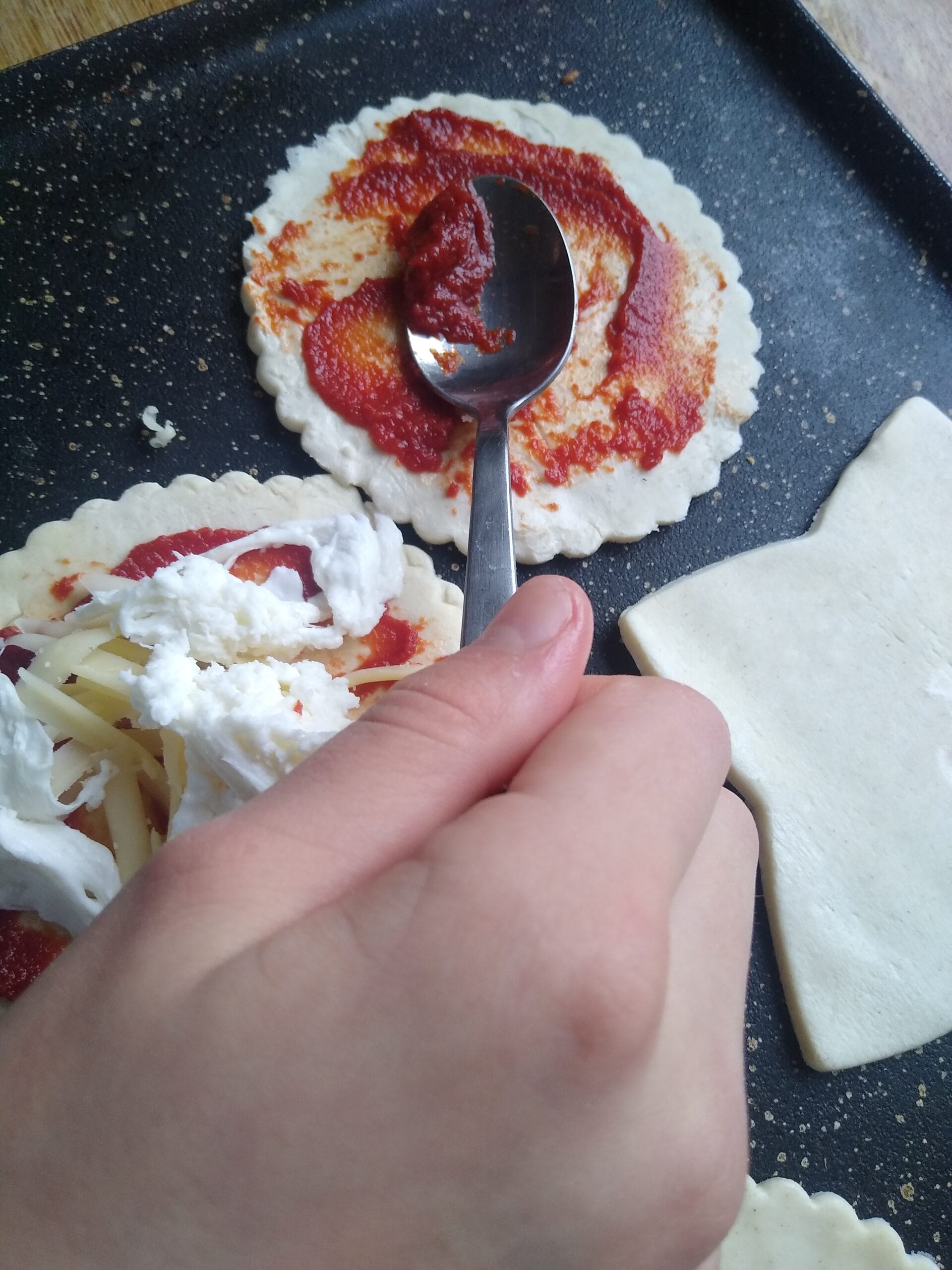 A parent and child cooking together in the kitchen. Benefits of children cooking.