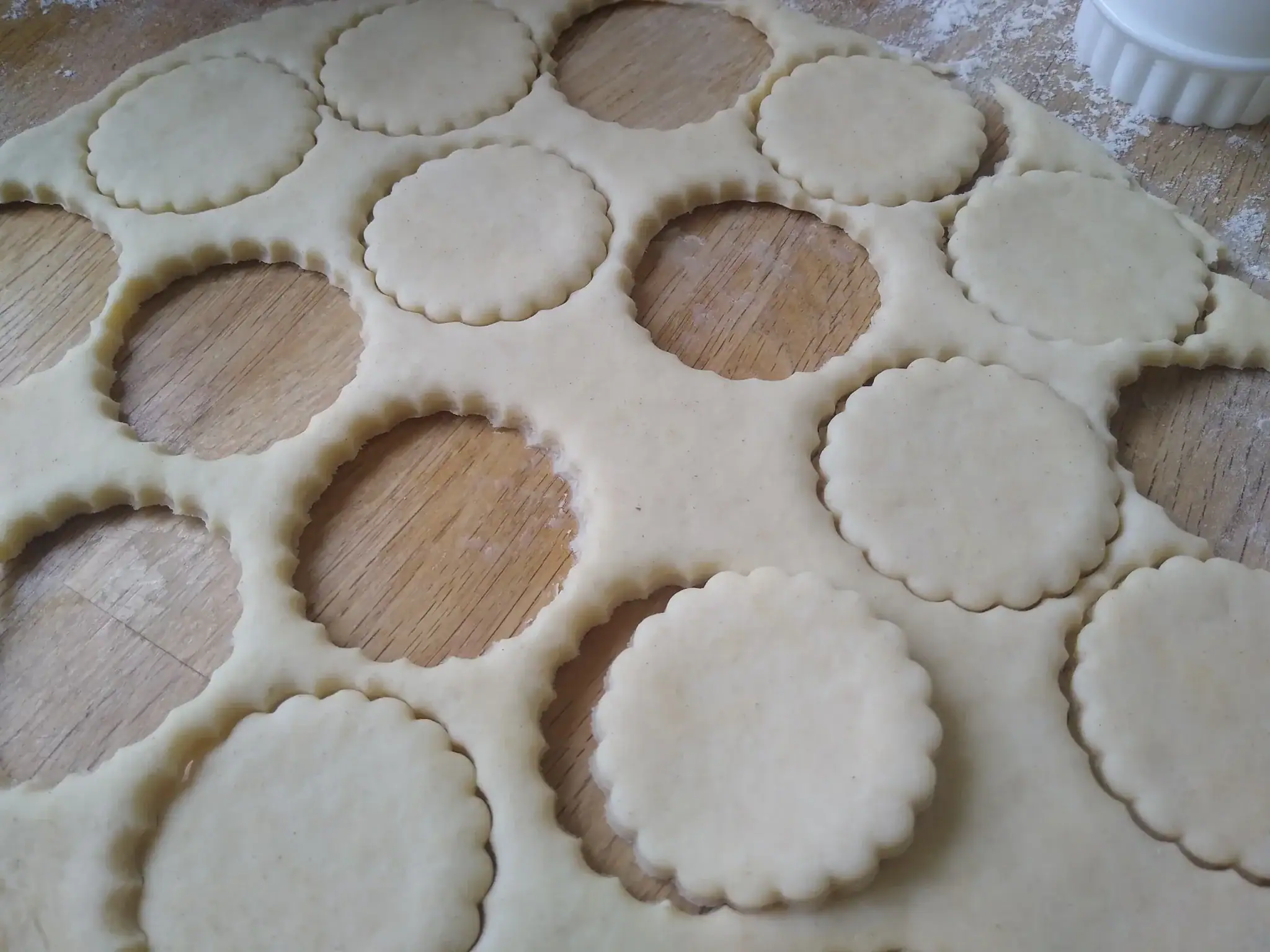 Dough rolled out with cutter shapes.