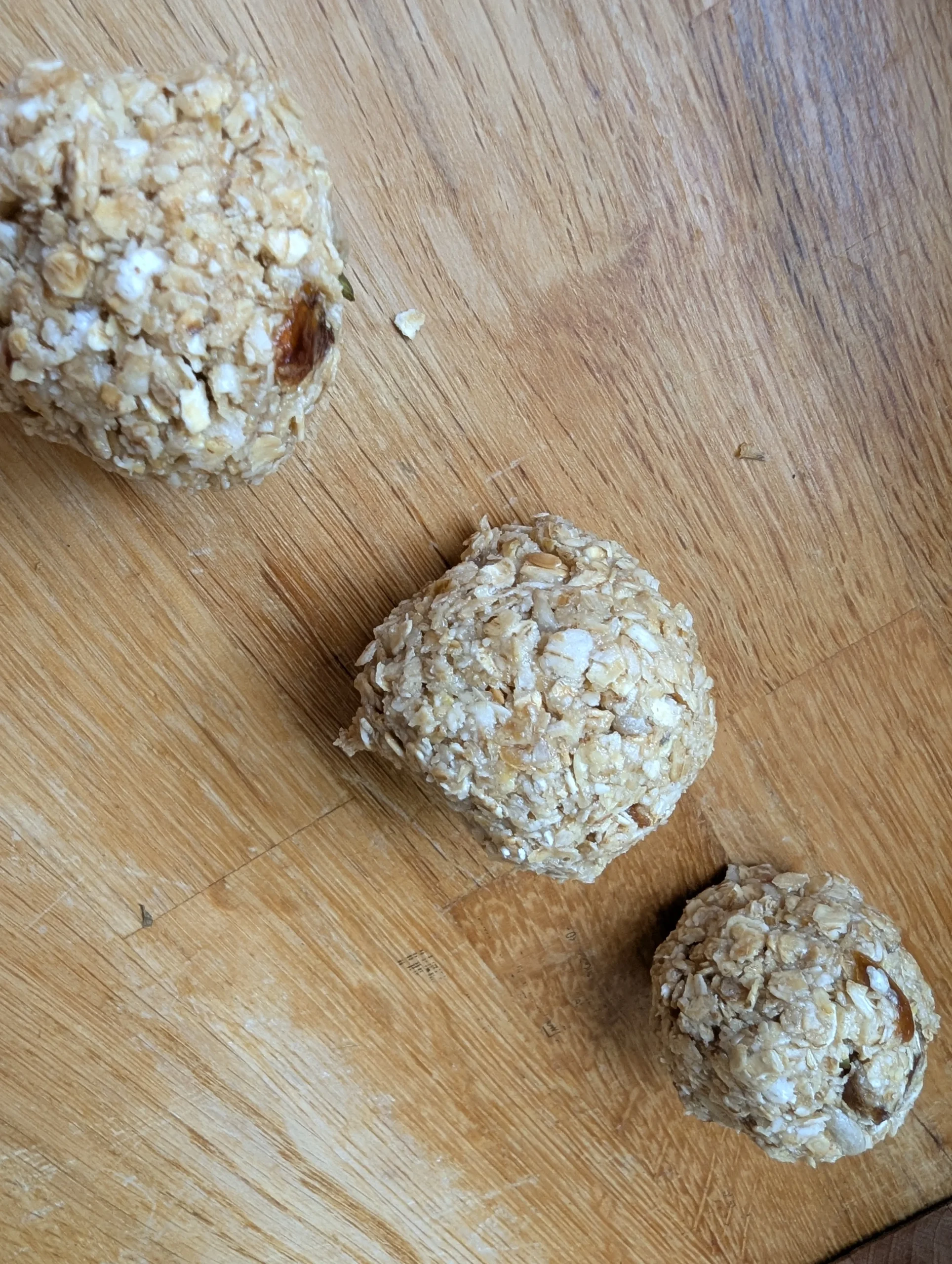 A plate of homemade no-bake energy balls with different mix-ins visible